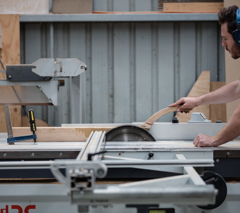 Action Shot of Daniel Poole on the Panel Saw - Woodworker and maker of the month - the local project