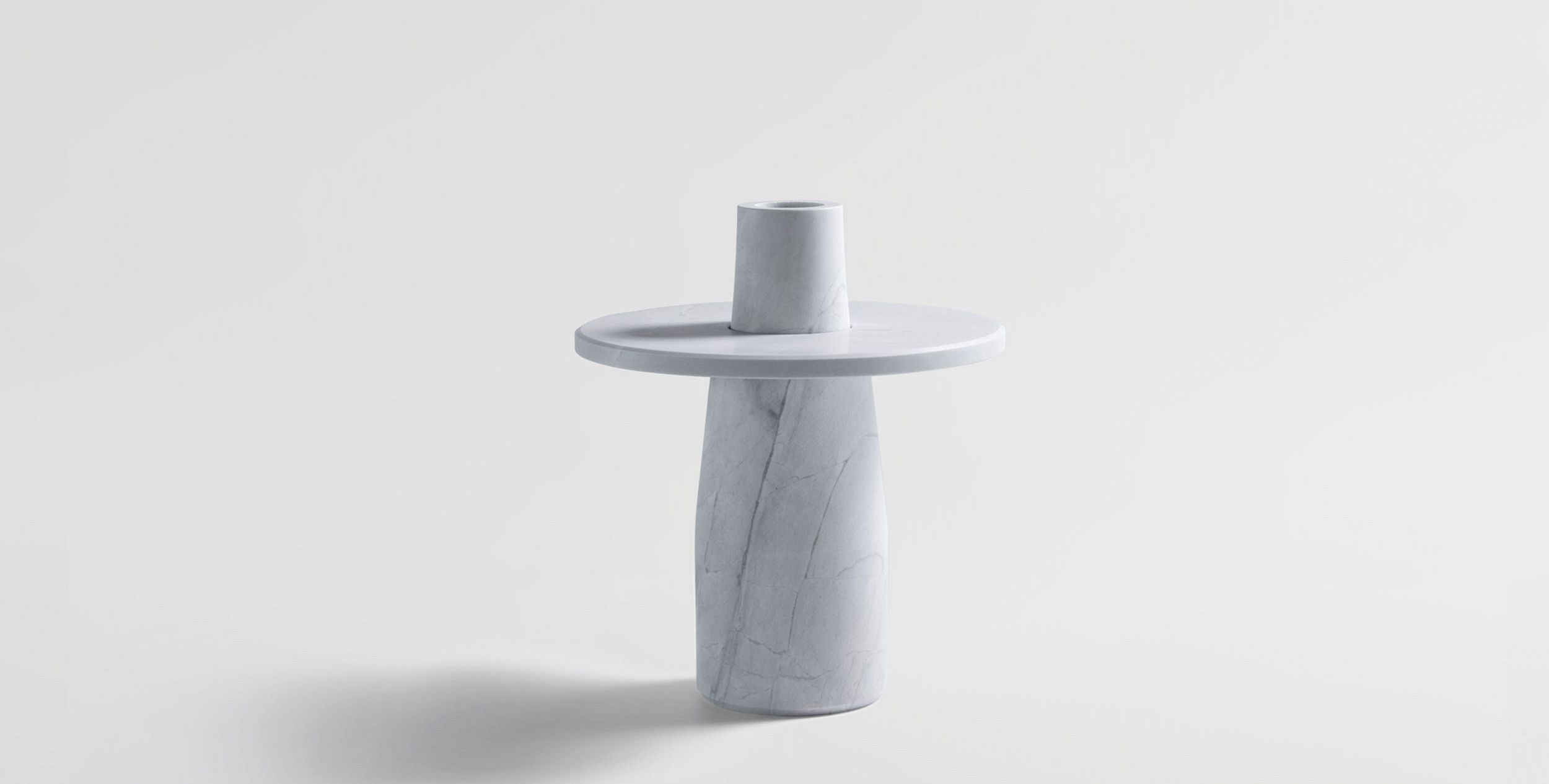 A Short Statured Vase Made From Solid Stone In Two Parts, The Semper Vase Is Designed To Highlight Fallen Leaves And Petals Through Capturing Them On Its