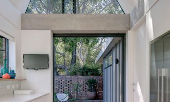 On Approach, The Inviting Wide Concrete Entry Projection Beckons The Visitor Into The Light Filled And Textural Home.