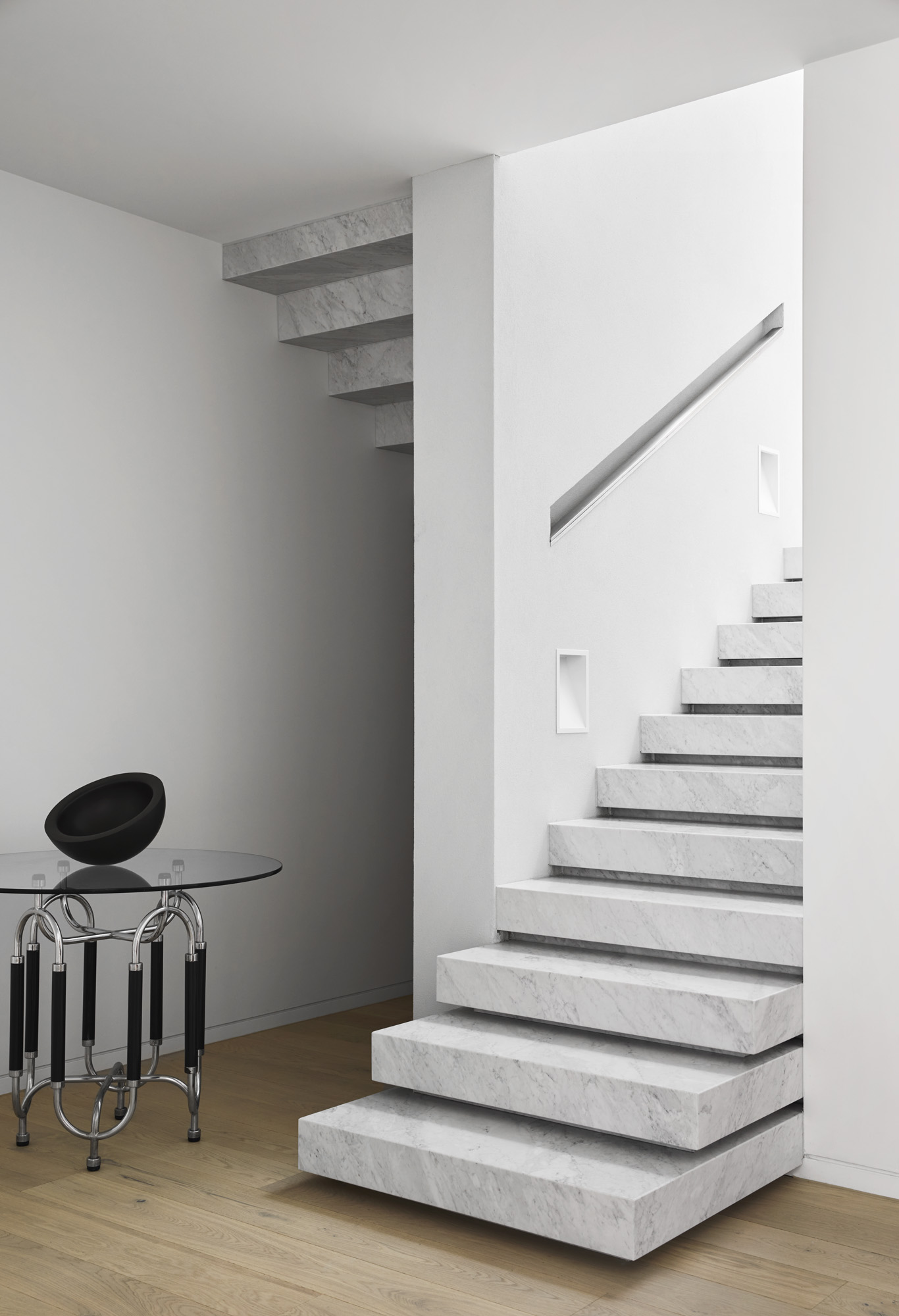 The External Shell Acts As A Protective Layer Surrounding The Spaces Inside, While Also Inviting In Outlooks To The Surrounding Verdant