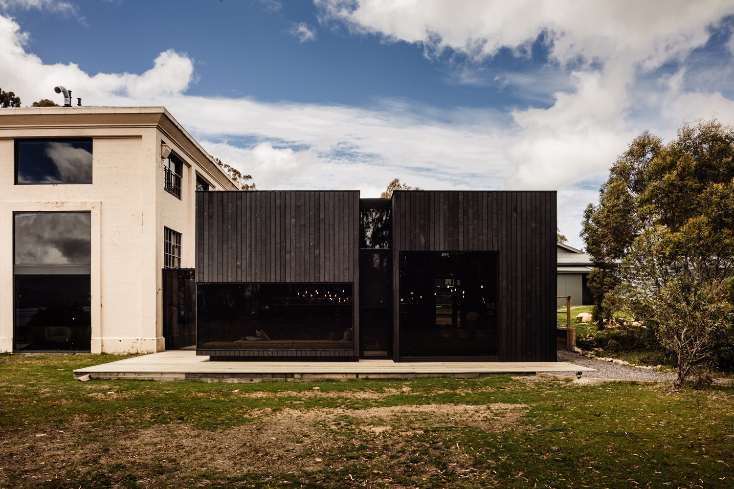 The Low, Dim Entrance Creates A Sense Of Compression Akin To A Burrow, Denying Views And Giving No Indication Of What Lies Within