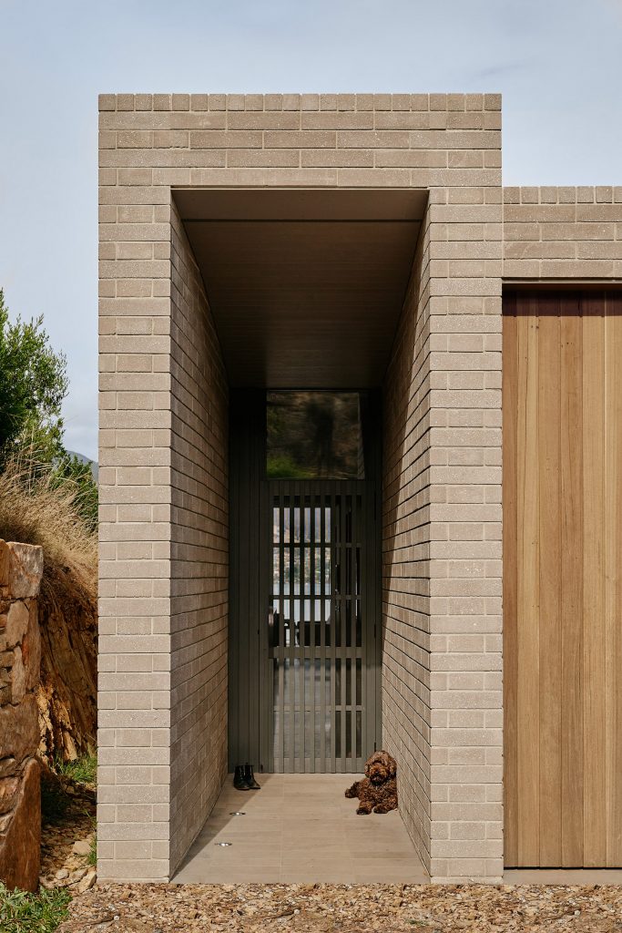 Topology Studio’s House At Otago Bay Is A Play On Concealing And Revealing Through Contrasting Locally Sourced Materiality And Dramatic Formal Res