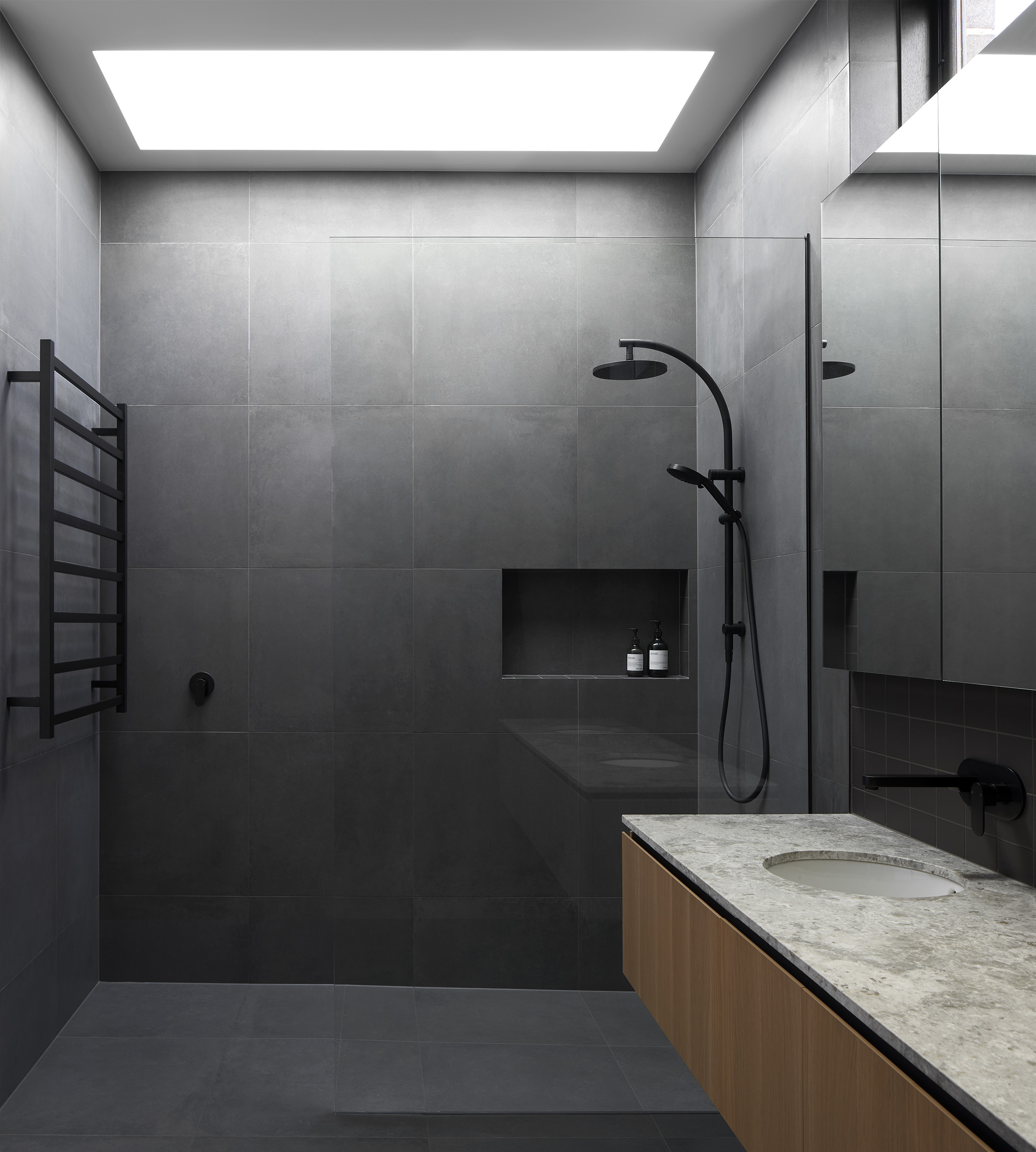 Timber Batten Screening And Masonry Walls Form A Protective Outer Layer.