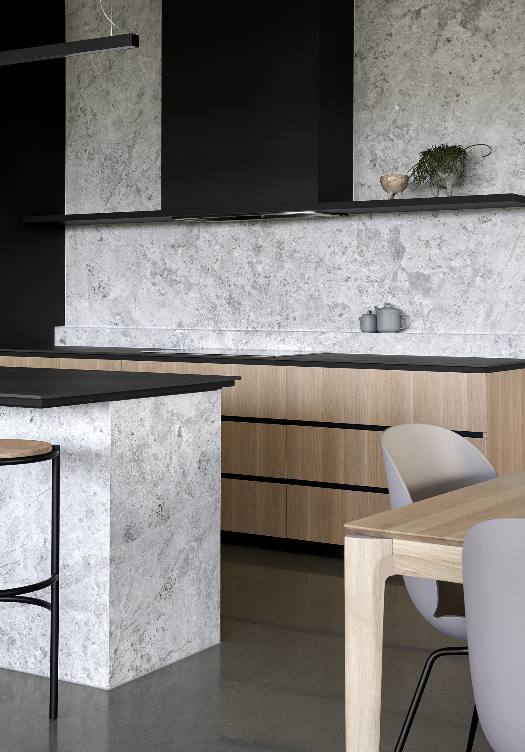 While A Combination Of Batten Screening And Dark Masonry Walls Create A Protective Outer Shell.