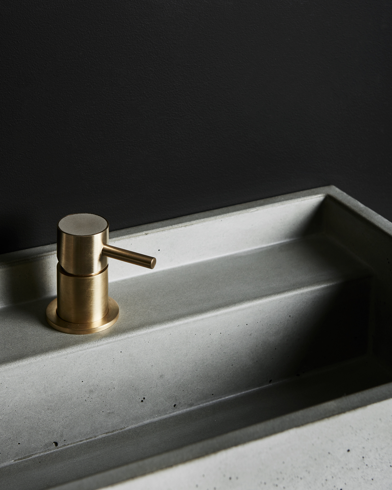 Evokes A Commanding Presence Atop The Vanity Unit, The Design’s Simplicity Of Form Highlighting The Strong Materiality Of Conc