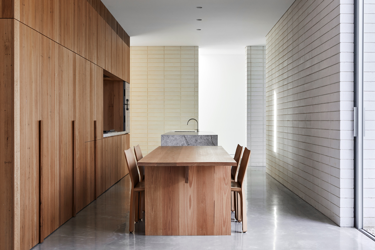 A Minimalist Combination Of Cream Masonry Blockwork And Timber Batten Screening, Edsall Street Presents An Almost Fortress Like Facade