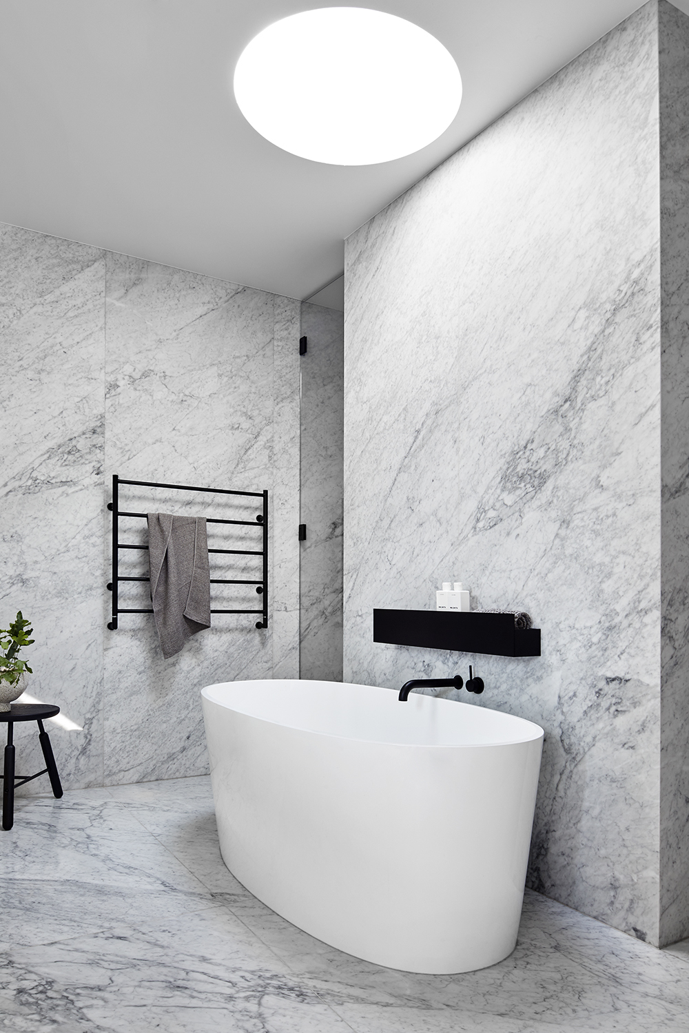 Large Slabs Of Striking Carrara Marble Are Used Throughout The Kitchen And Again In The Bathrooms, Subtly Linking These Spaces Through