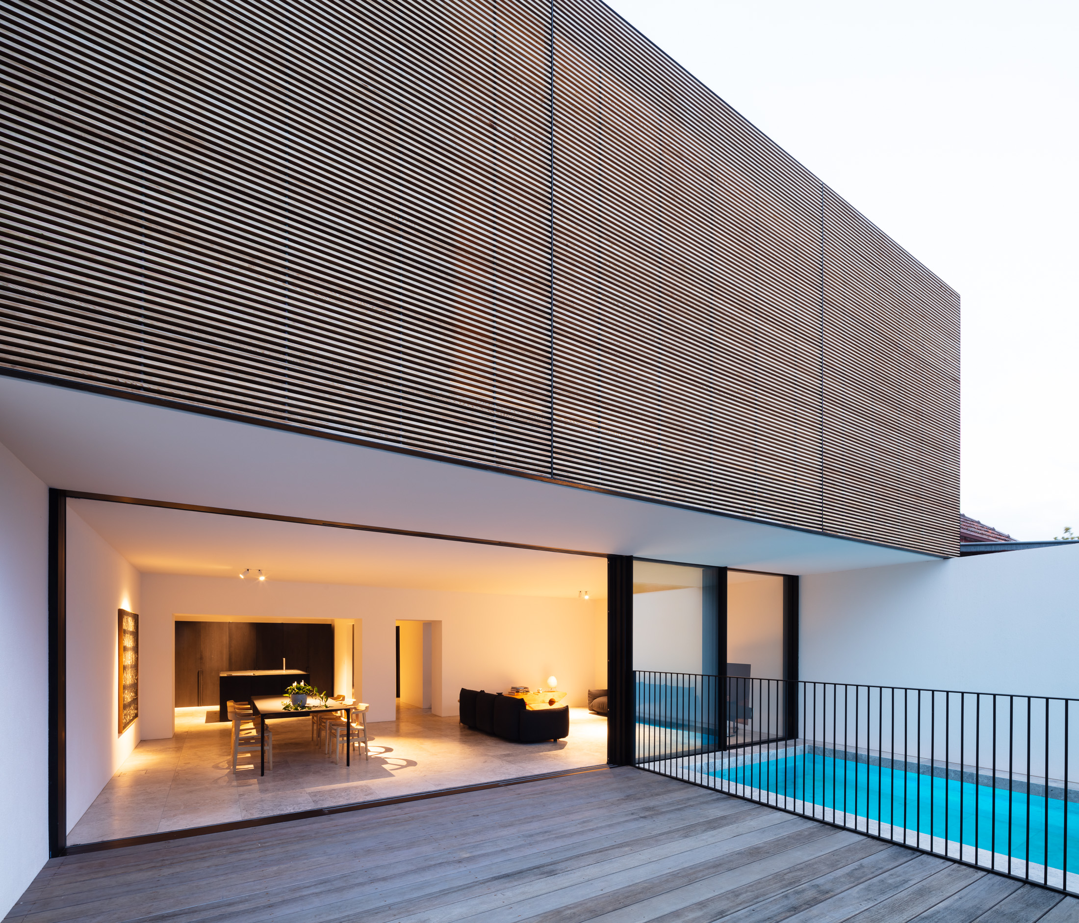 The Result Is A Clean, Minimalist Space That Enhances And Harmonises With The Living Area It Flows Into, Where Limestone Tiles And Crisp Whit